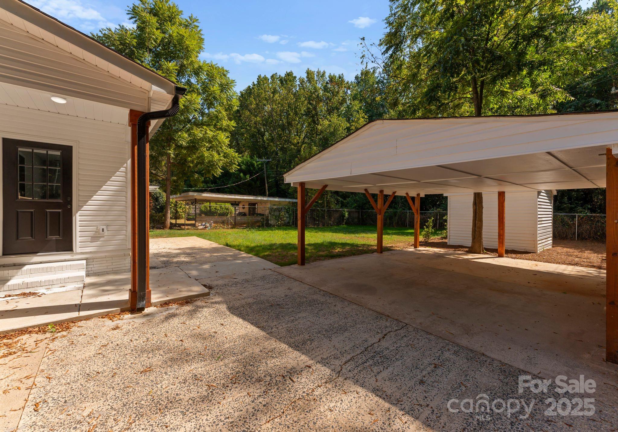 2900 Enfield Road Charlotte, NC 28205 - Photo 25 of 35 a view of a house with porch and garden
