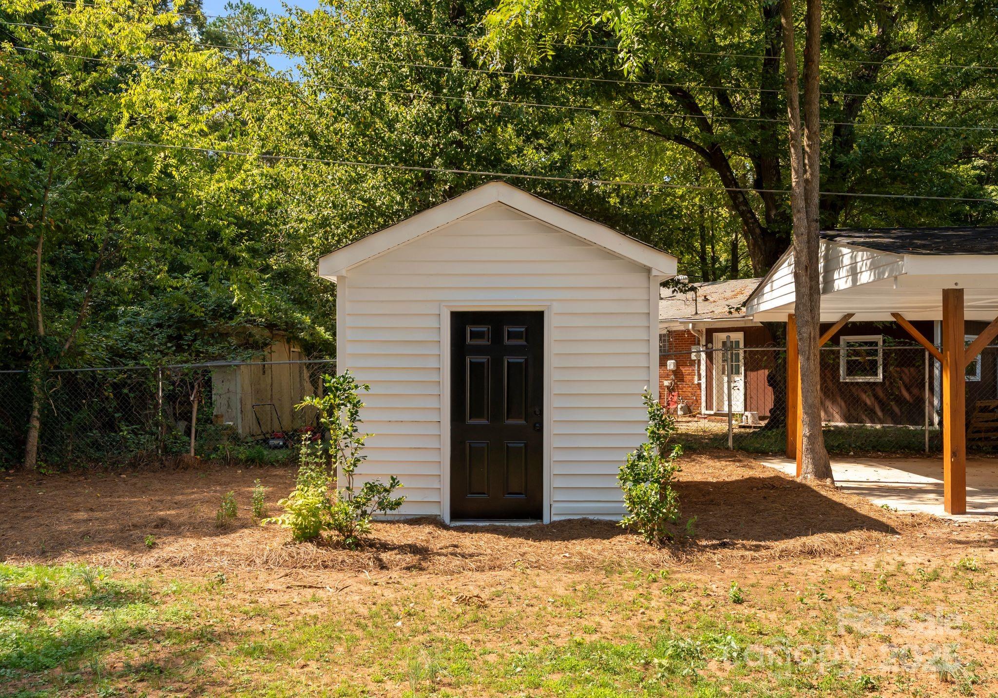 2900 Enfield Road Charlotte, NC 28205 - Photo 27 of 35 a front view of a house with a yard