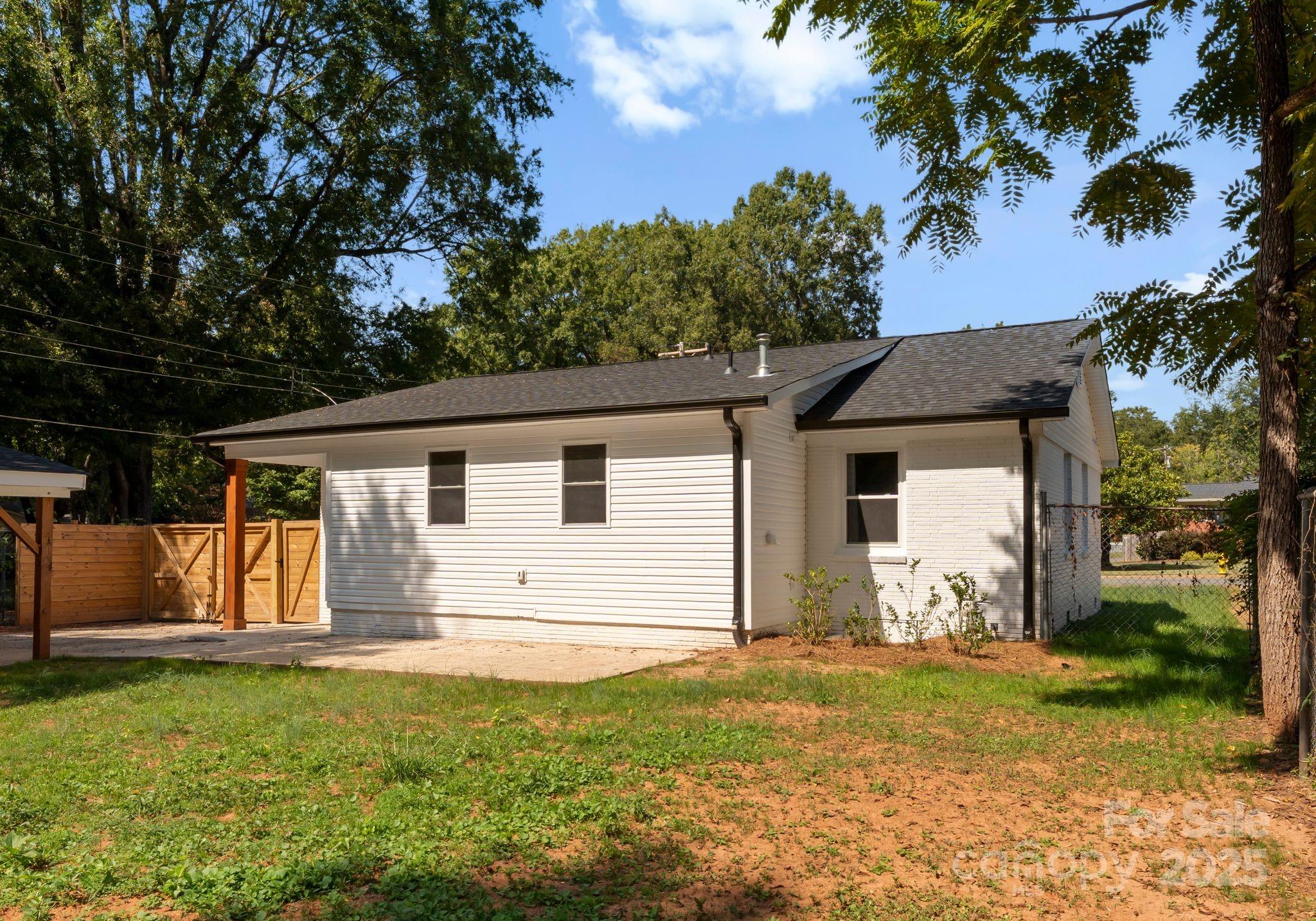 2900 Enfield Road Charlotte, NC 28205 - Photo 29 of 35 a view of a house with a yard