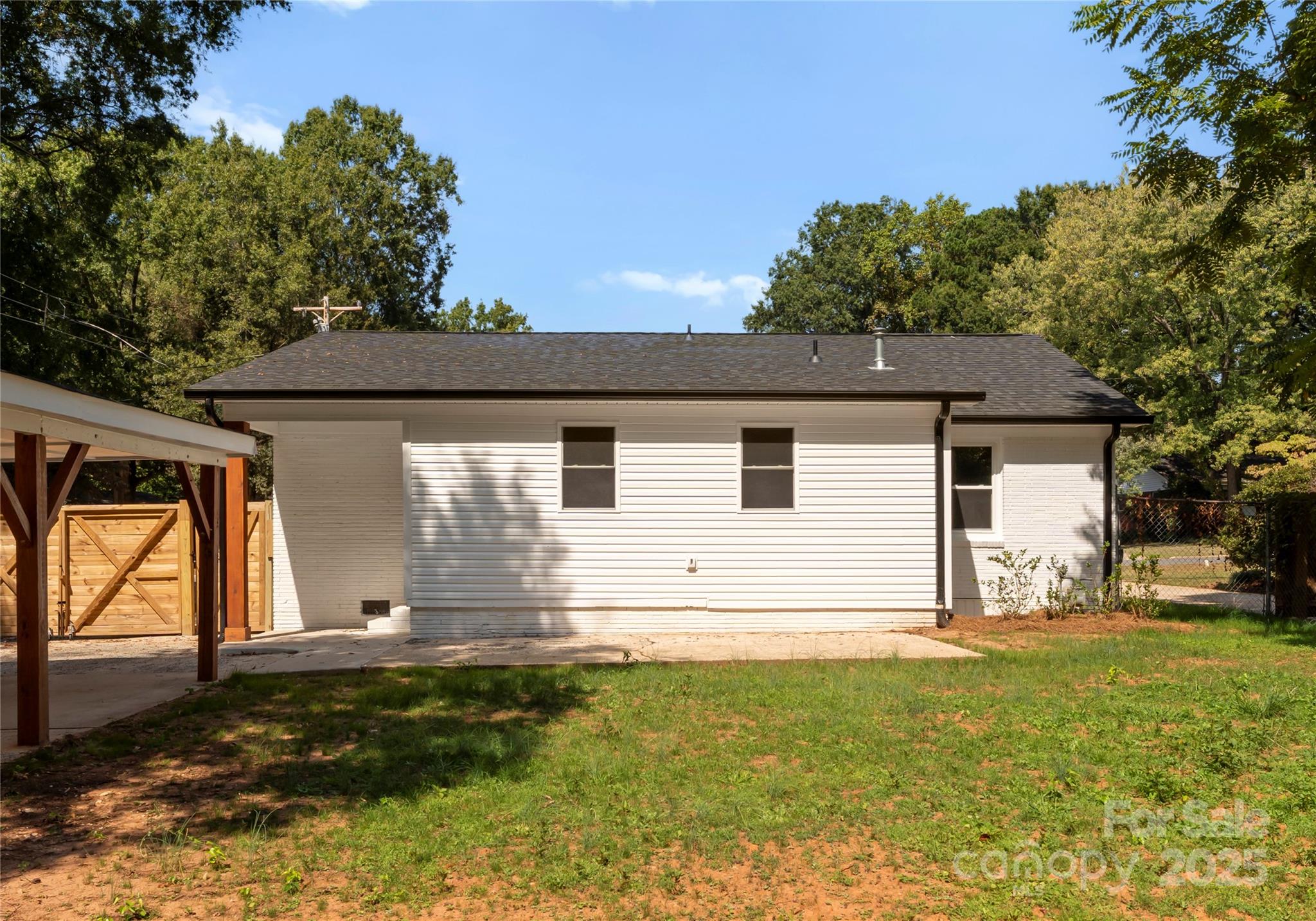 2900 Enfield Road Charlotte, NC 28205 - Photo 30 of 35 a view of a house with a yard