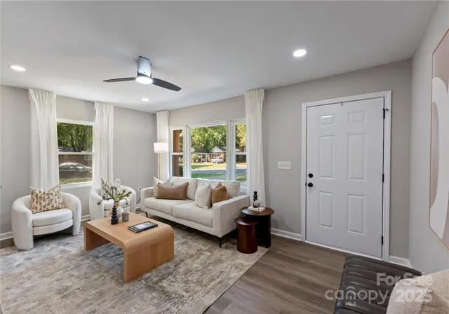 a living room with furniture and a large window