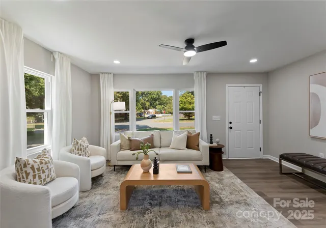 a living room with furniture and a large window