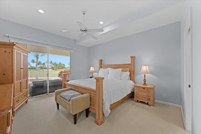 a bedroom with a bed and a lamp