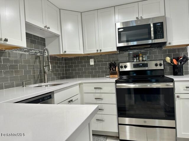 2631 Hancock Road Hancock, MA 01267 - Photo 12 of 55 a kitchen with granite countertop a stove sink and microwave