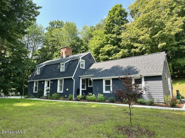 2631 Hancock Road Hancock, MA 01267 - Photo 3 of 55 a front view of a house with a garden