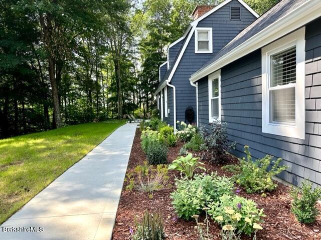 2631 Hancock Road Hancock, MA 01267 - Photo 4 of 55 a front view of a house with garden