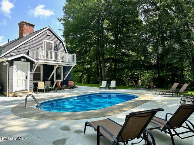 2631 Hancock Road Hancock, MA 01267 - Photo 6 of 55 a view of a house with swimming pool and sitting area