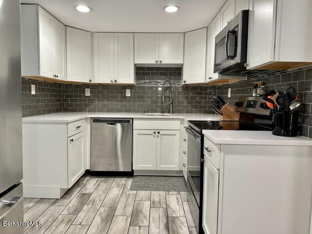 2631 Hancock Road Hancock, MA 01267 - Photo 9 of 55 a kitchen with a sink a stove and cabinets