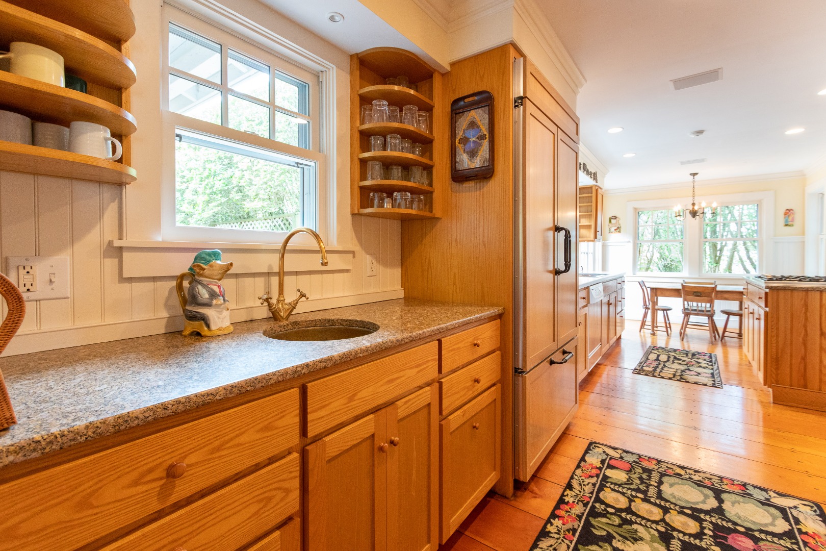 15 Cliff Road Nantucket, MA 02554 - Photo 18 of 50 a open kitchen with stainless steel appliances granite countertop a stove a sink and a refrigerator with wooden floor