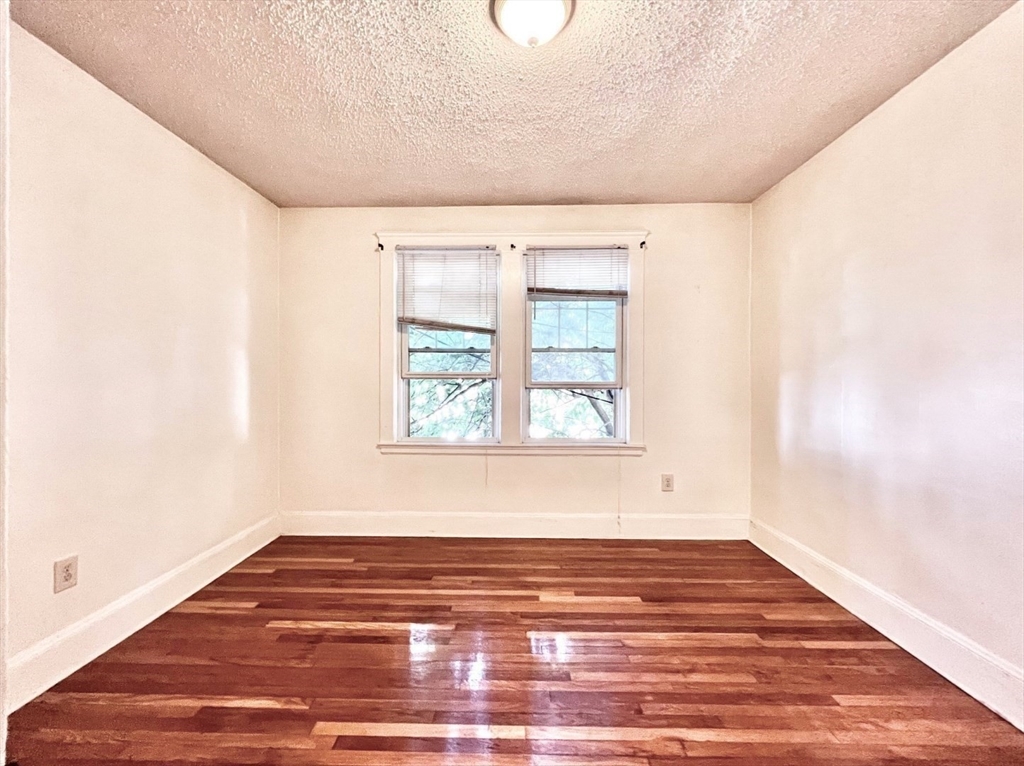26 Chiswick Road, Unit 6 Boston, MA 02135 - Photo 22 of 24 a view of a room with wooden floor and window