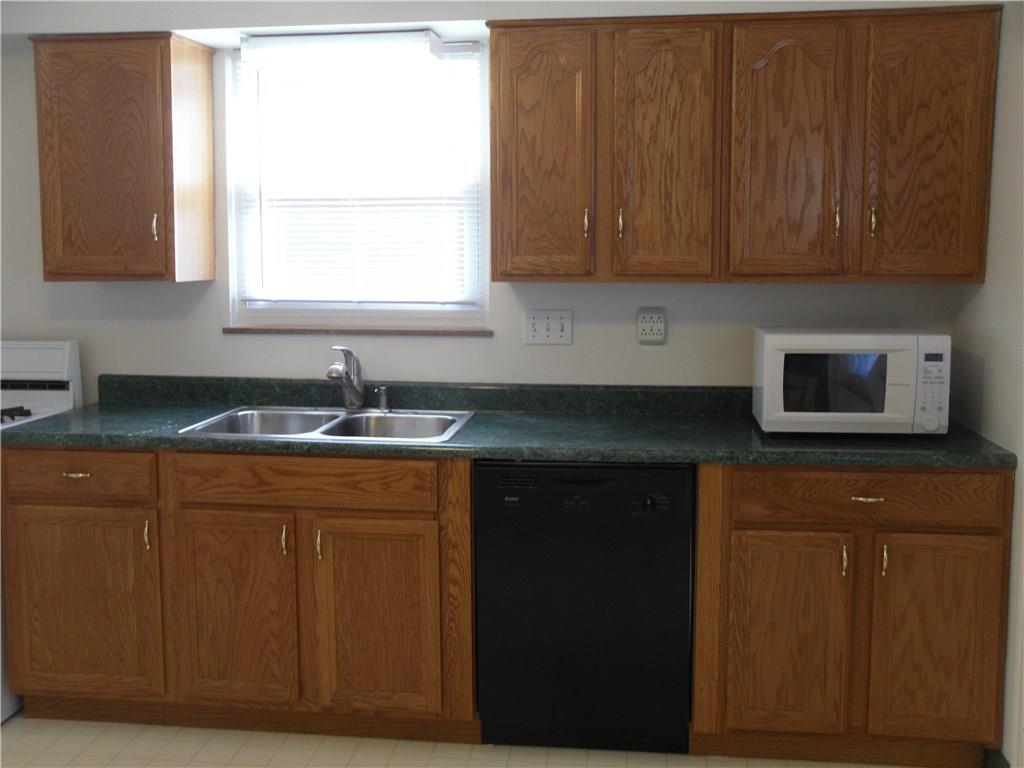 783 Thompson Run Road Pittsburgh, PA 15237 - Photo 7 of 25 Kitchen with Oak Cabinets, Dishwasher, and Gas Stove