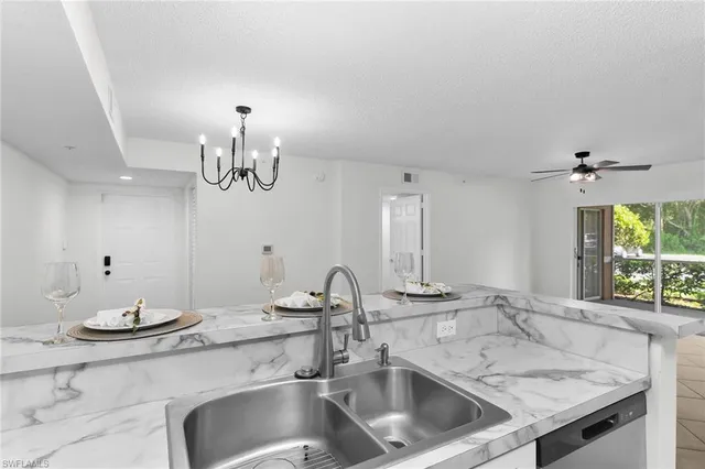 a kitchen with a sink and a stove