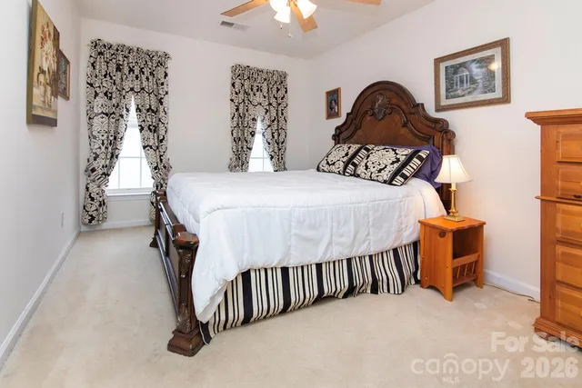 a bed room with a bed and a chandelier