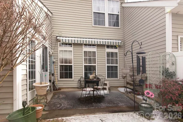 a front view of a house with outdoor seating