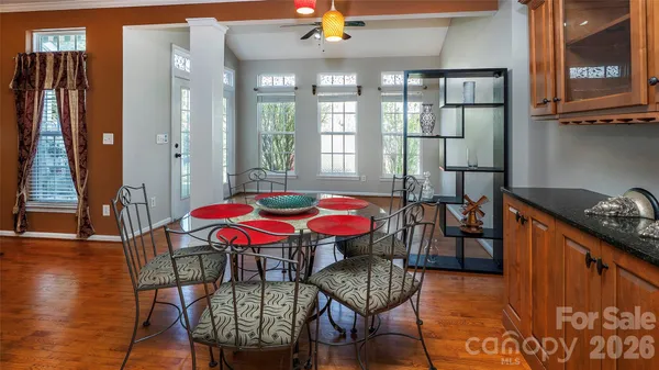 a view of a dining room with furniture window and wooden floor