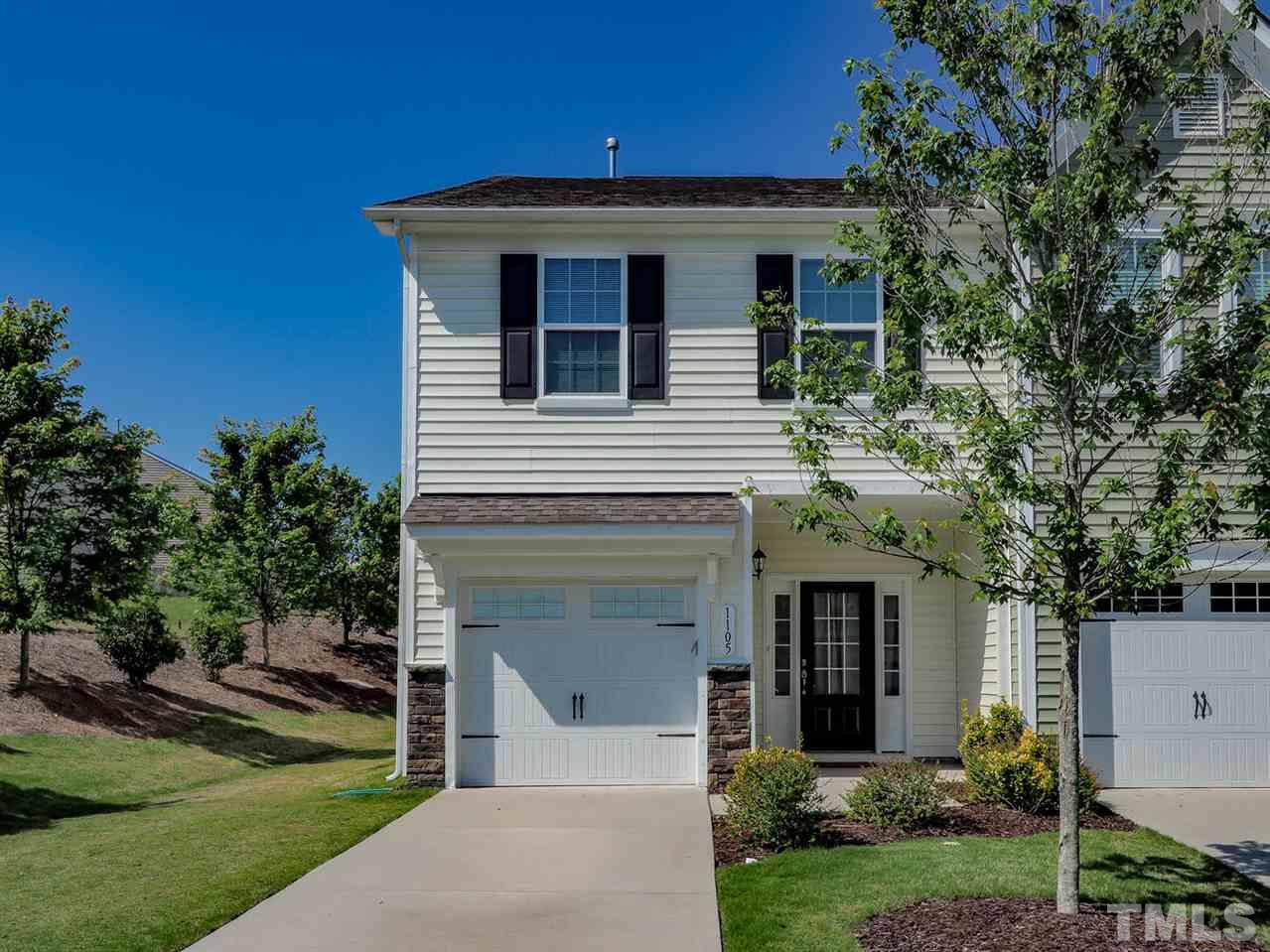 1105 Falcon Ridge Lane Morrisville, NC 27560 - Photo 2 of 22 a front view of a house with a yard