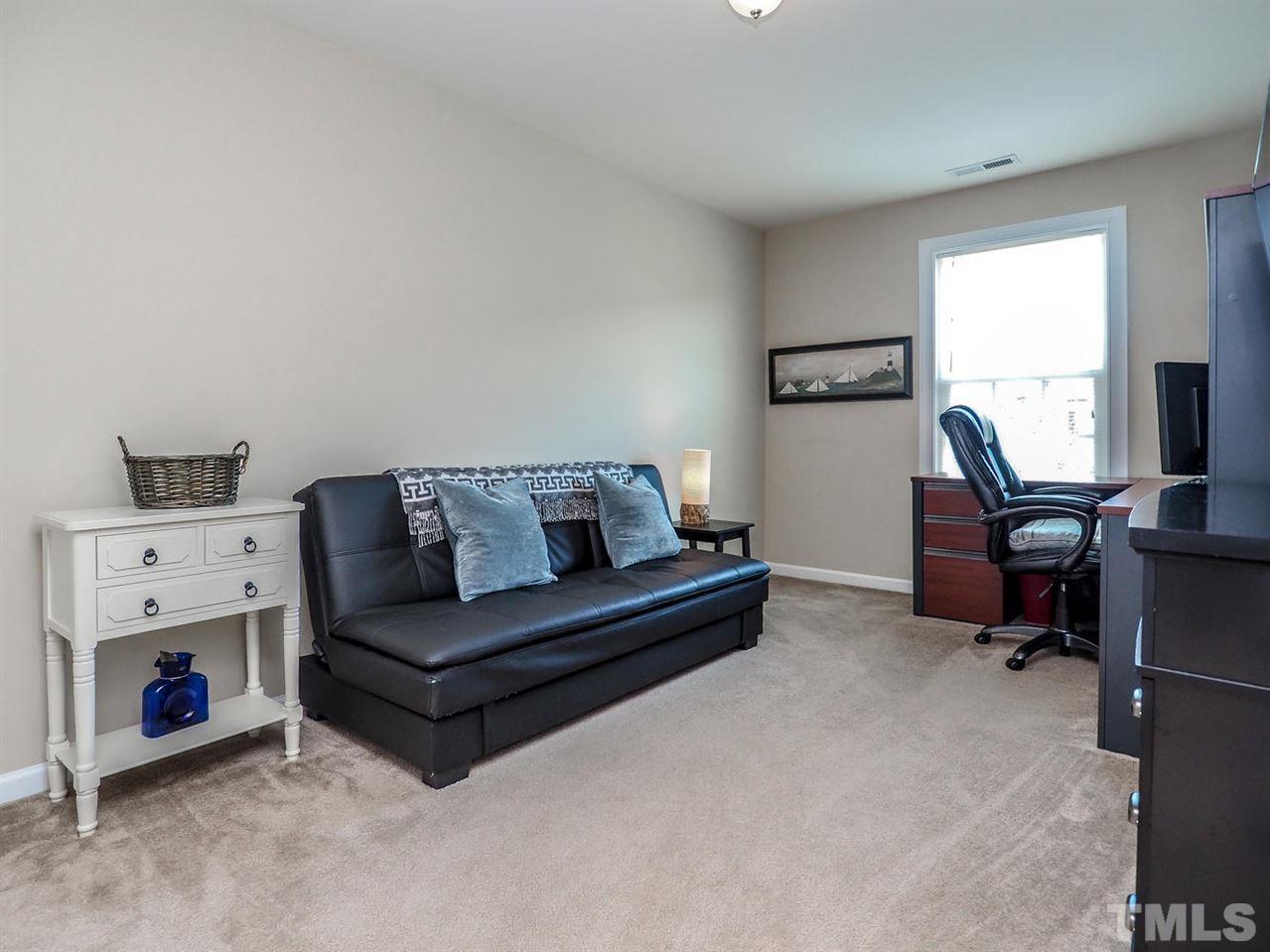 1105 Falcon Ridge Lane Morrisville, NC 27560 - Photo 15 of 22 a living room with furniture and a window