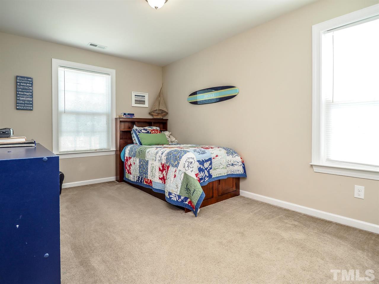 1105 Falcon Ridge Lane Morrisville, NC 27560 - Photo 16 of 22 a bedroom with a bed and a window