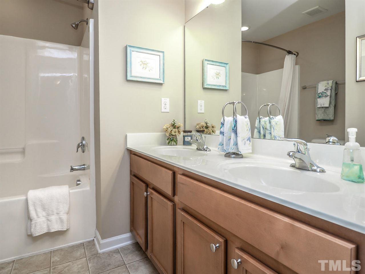 1105 Falcon Ridge Lane Morrisville, NC 27560 - Photo 17 of 22 a bathroom with a sink and a mirror