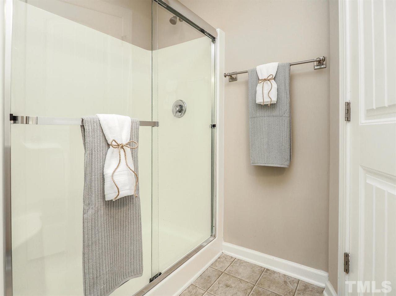 1105 Falcon Ridge Lane Morrisville, NC 27560 - Photo 22 of 22 a bathroom with a shower