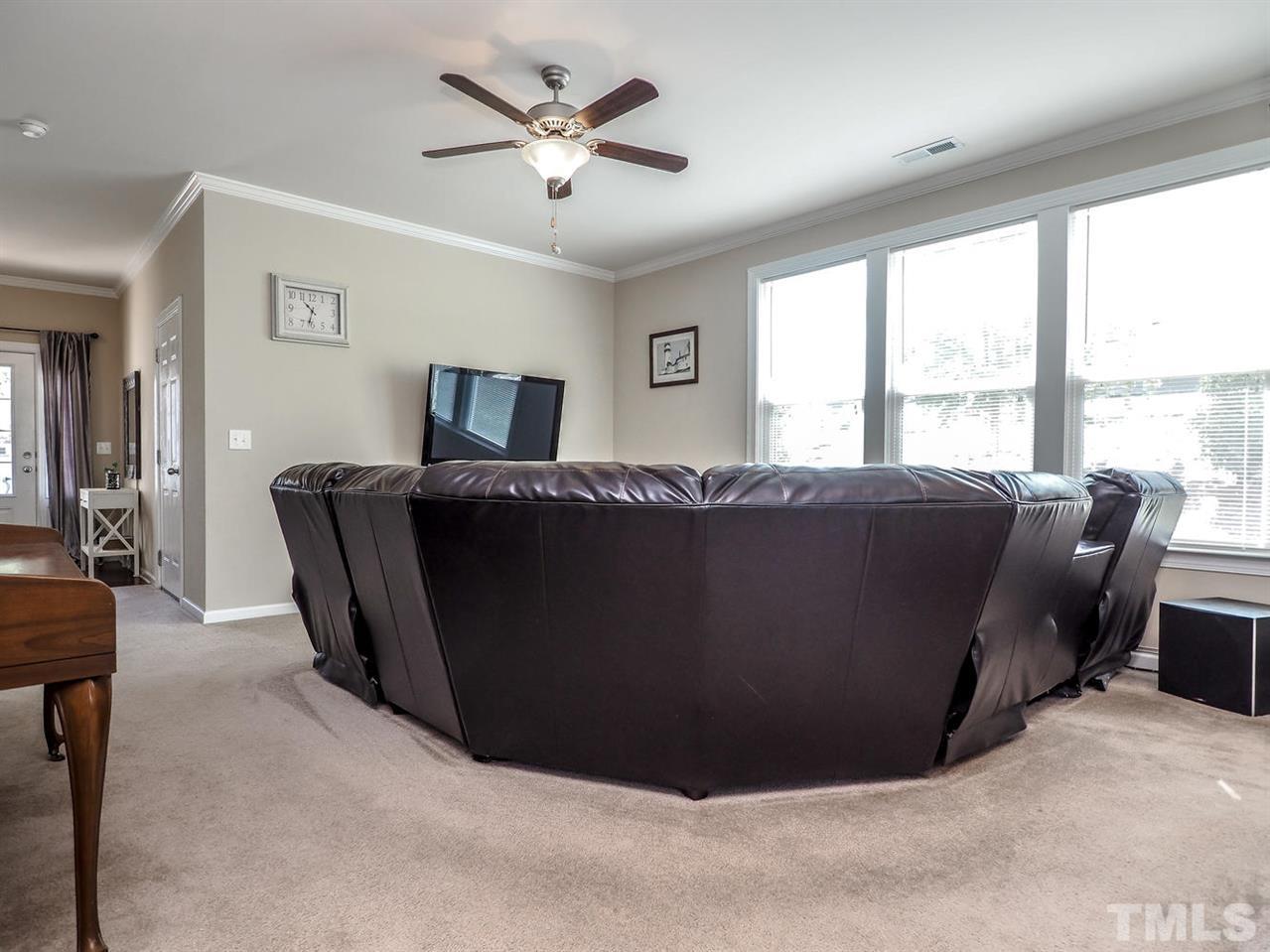 1105 Falcon Ridge Lane Morrisville, NC 27560 - Photo 7 of 22 a living room with furniture and a large window