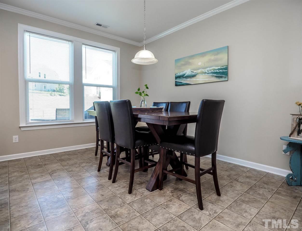 1105 Falcon Ridge Lane Morrisville, NC 27560 - Photo 8 of 22 a view of a dining room with furniture
