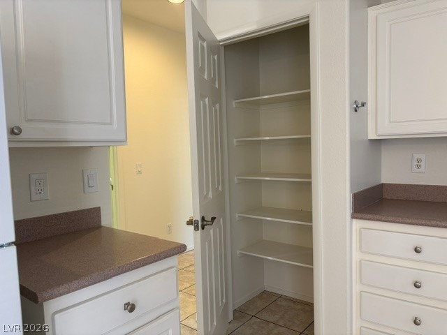 2866 Shimmering Bay Street Laughlin, NV 89029 - Photo 11 of 32 Ample storage solutions abound within this well-appointed kitchen pantry and surrounding cabinetry.