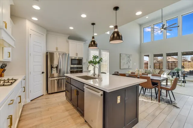 a view of an house with backyard space and balcony