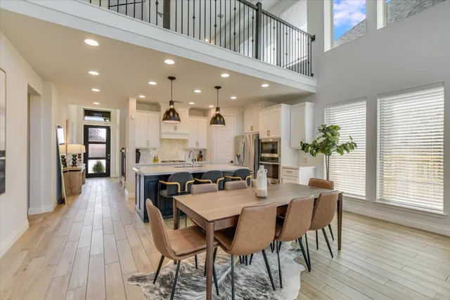 a kitchen with a table and chairs in it