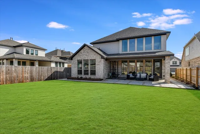 a view of yard with patio