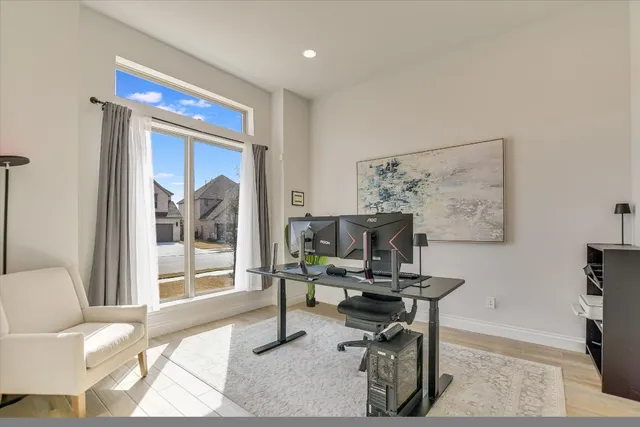 a workspace with furniture and a gate