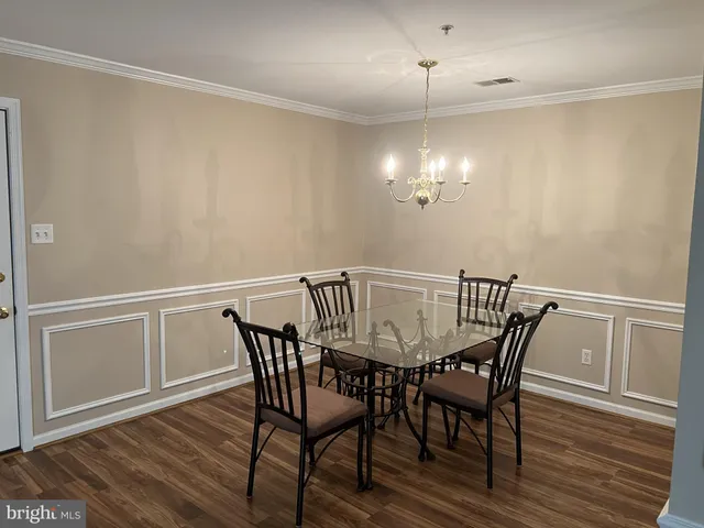 a view of kitchen with granite countertop cabinets and appliances