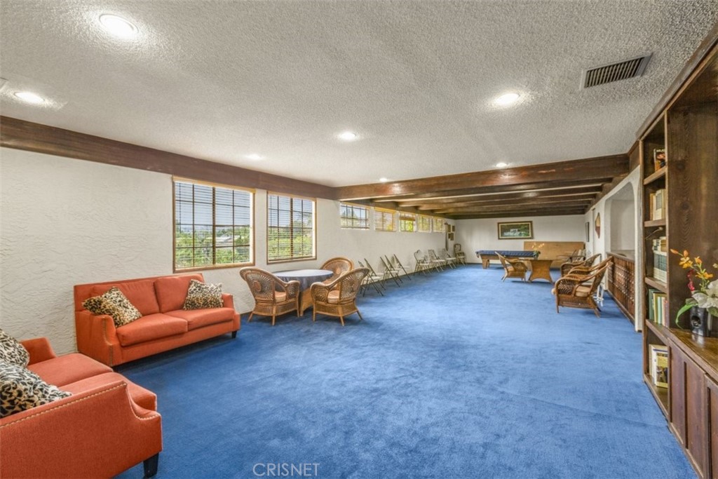 12830 Burbank Boulevard, Unit 316 Valley Village, CA 91607 - Photo 16 of 18 a living room with furniture and a couch