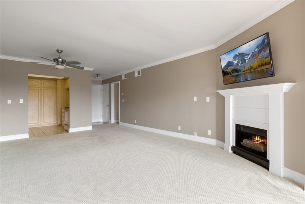 12830 Burbank Boulevard, Unit 316 Valley Village, CA 91607 - Photo 5 of 18 a view of an empty room with a fireplace