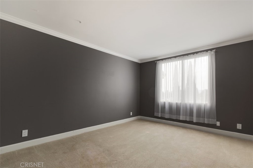 12830 Burbank Boulevard, Unit 316 Valley Village, CA 91607 - Photo 10 of 18 an empty room with windows