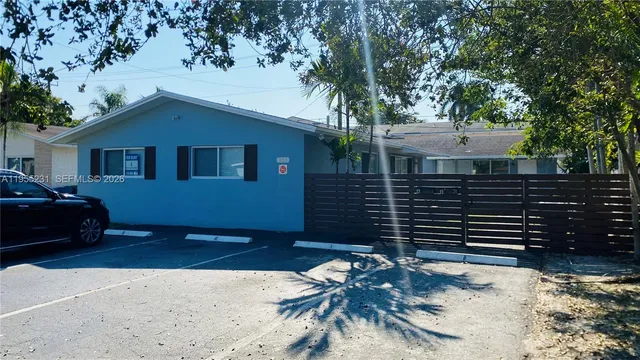 a view of a livingroom with kitchen and furniture