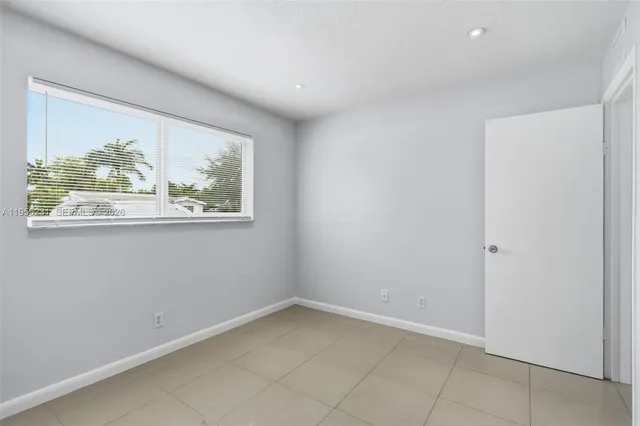 a bathroom with a sink mirror toilet and shower