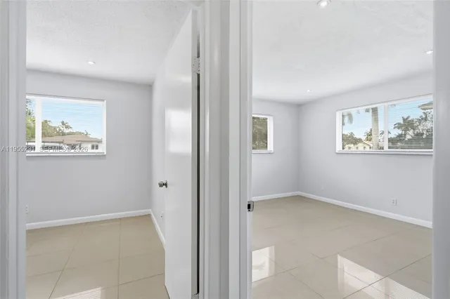 a view of room with window and hallway