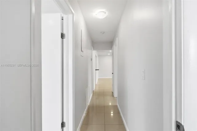 a view of a bathroom from a hallway