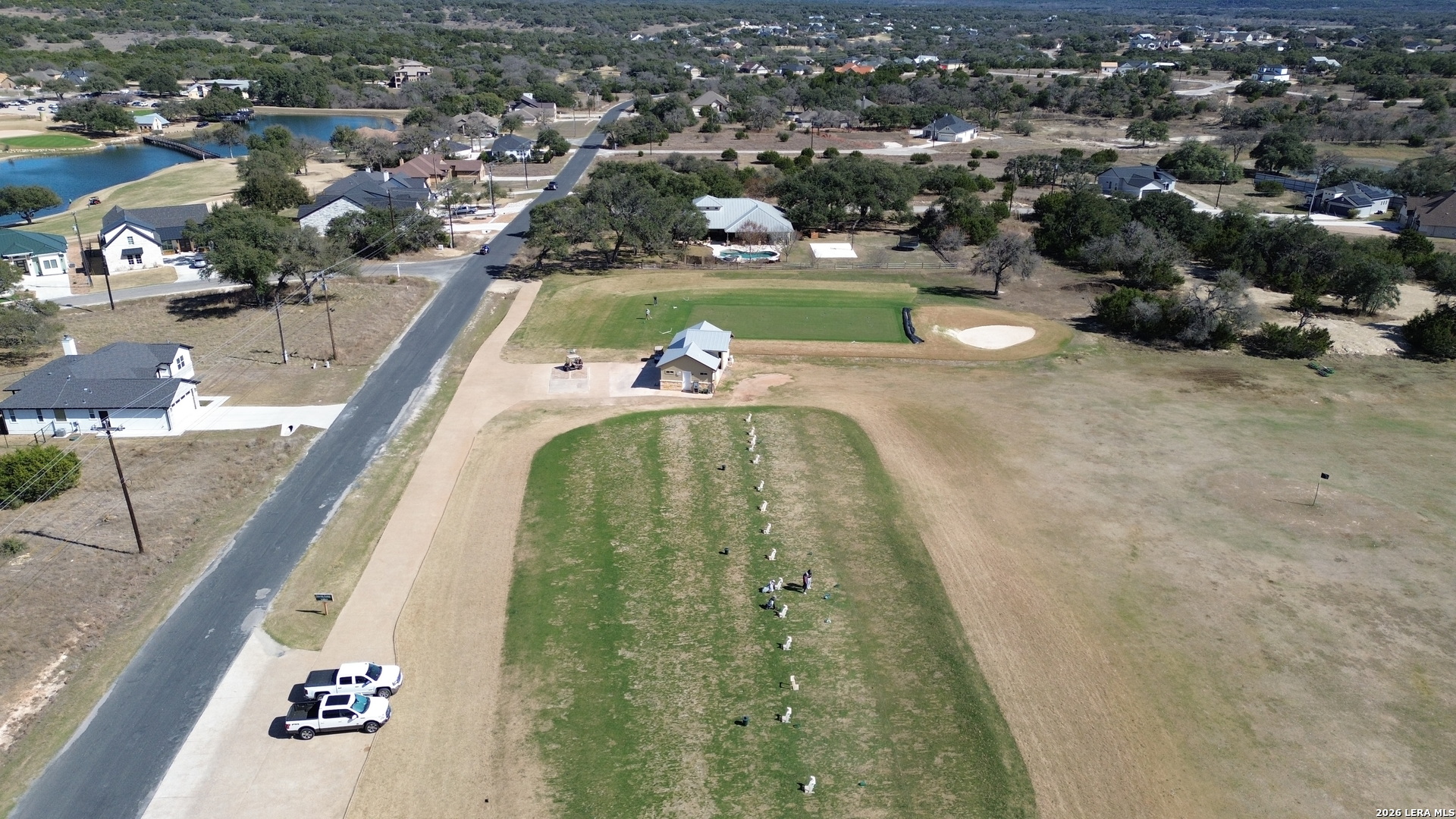 222 North Calvin Barrett Blanco, TX 78606 - Photo 12 of 33 an aerial view of a house with a swimming pool yard and lake view