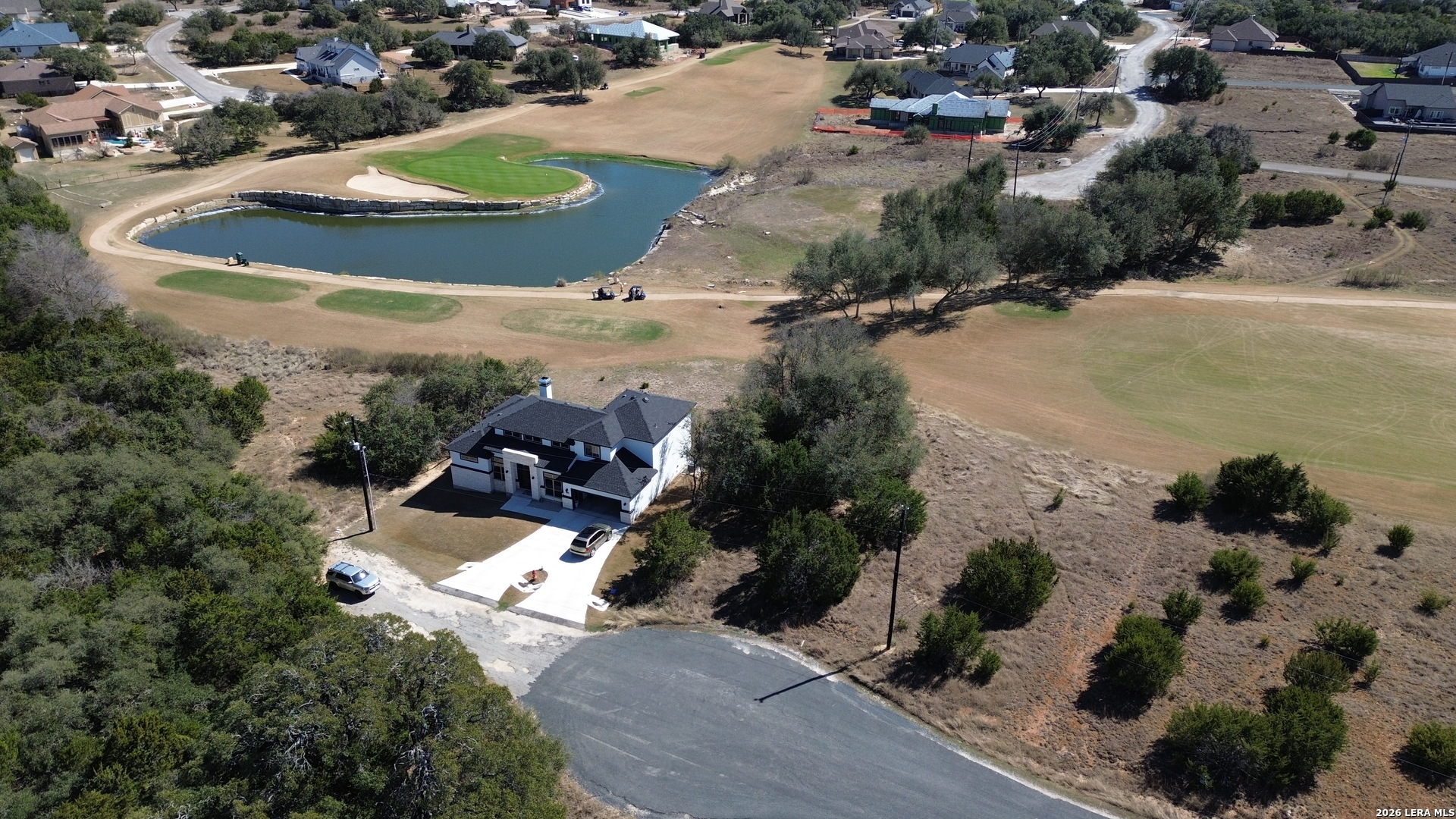 222 North Calvin Barrett Blanco, TX 78606 - Photo 17 of 33 an aerial view of a house with a yard and lake view