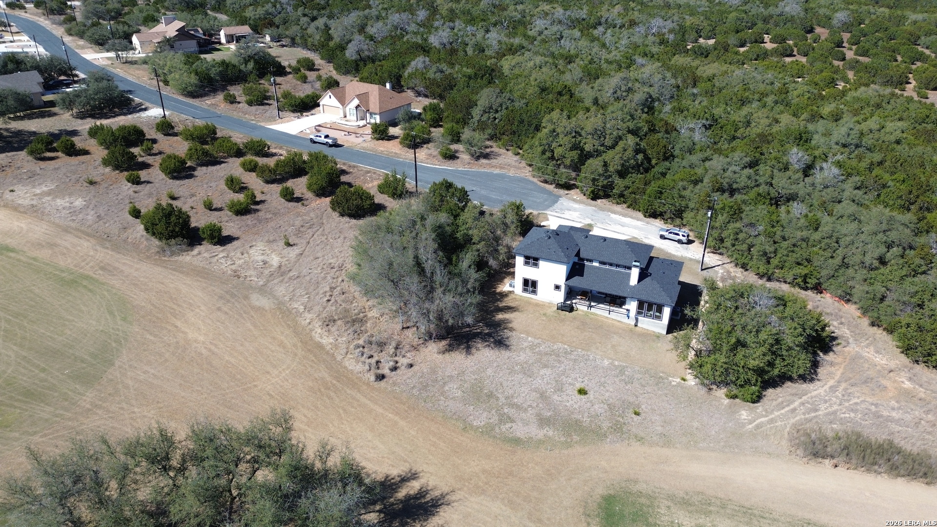 222 North Calvin Barrett Blanco, TX 78606 - Photo 25 of 33 an aerial view of a house with a yard and tree s