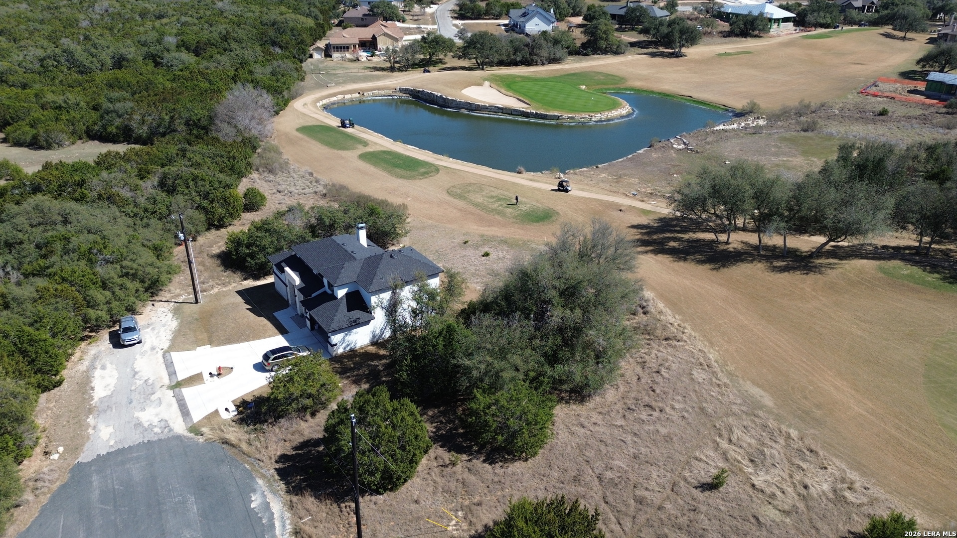 222 North Calvin Barrett Blanco, TX 78606 - Photo 28 of 33 an aerial view of a house with a yard and lake view