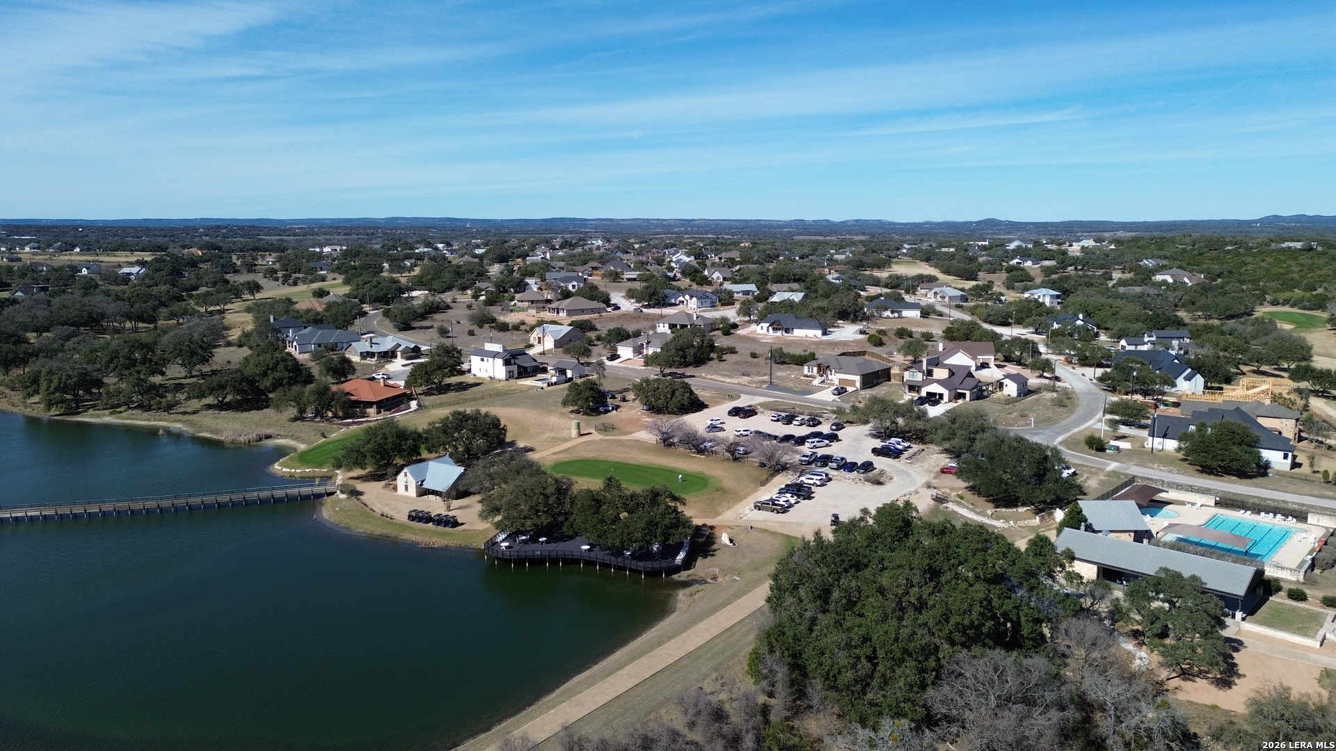 222 North Calvin Barrett Blanco, TX 78606 - Photo 6 of 33 an aerial view of a city with lots of residential buildings ocean and mountain view in back