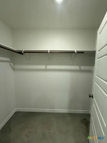 a view of an empty walk in closet