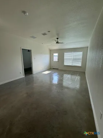 a view of a livingroom and a window