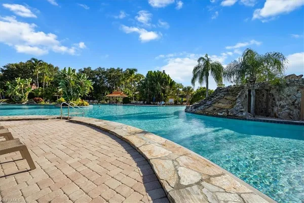 a view of a swimming pool with a yard