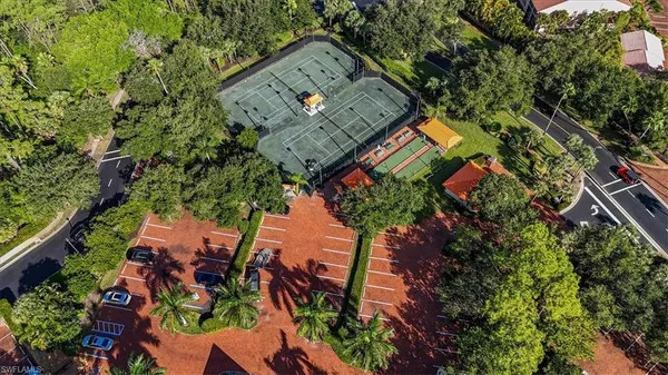 an aerial view of a residential houses with outdoor space