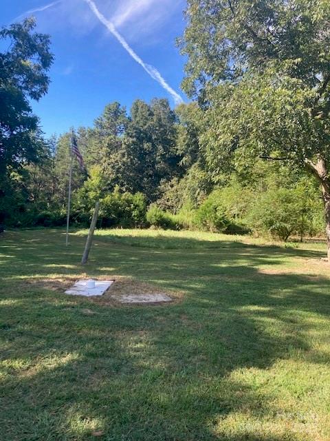 6700 Sisk-Carter Road Rockwell, NC 28138 - Photo 14 of 26 a view of a green field with wooden fence