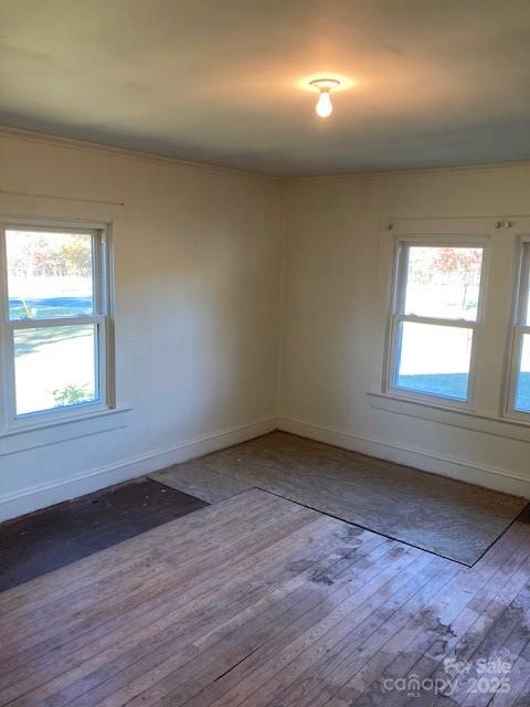 6700 Sisk-Carter Road Rockwell, NC 28138 - Photo 20 of 26 an empty room with wooden floor and windows